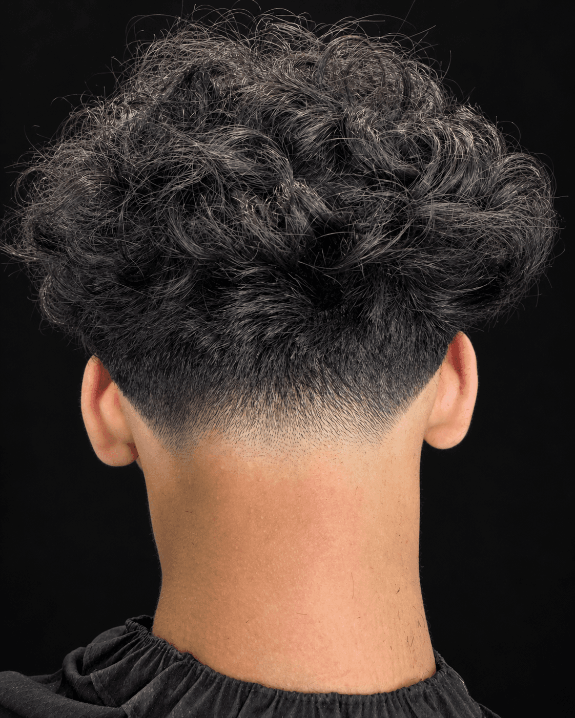 Low taper with natural curls from Casper's portfolio